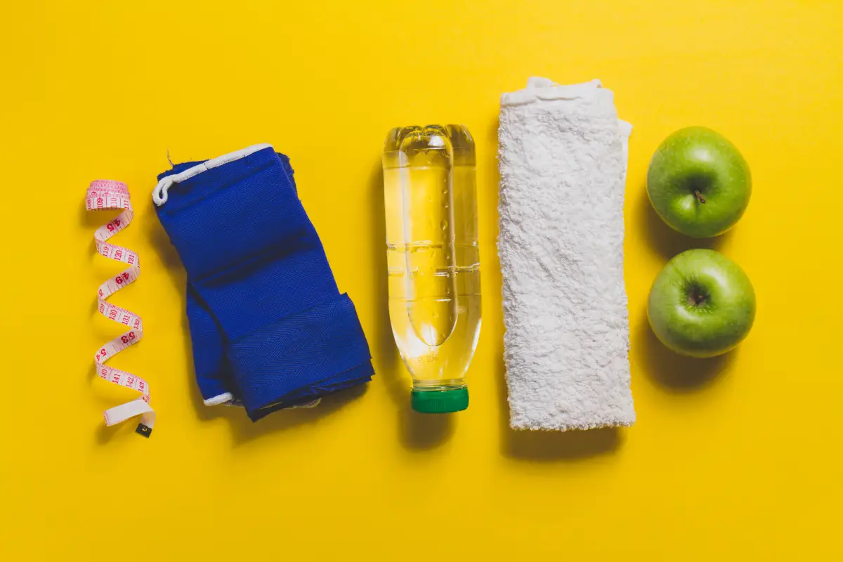Assortment of Pure Protein bars with fitness equipment in the background.