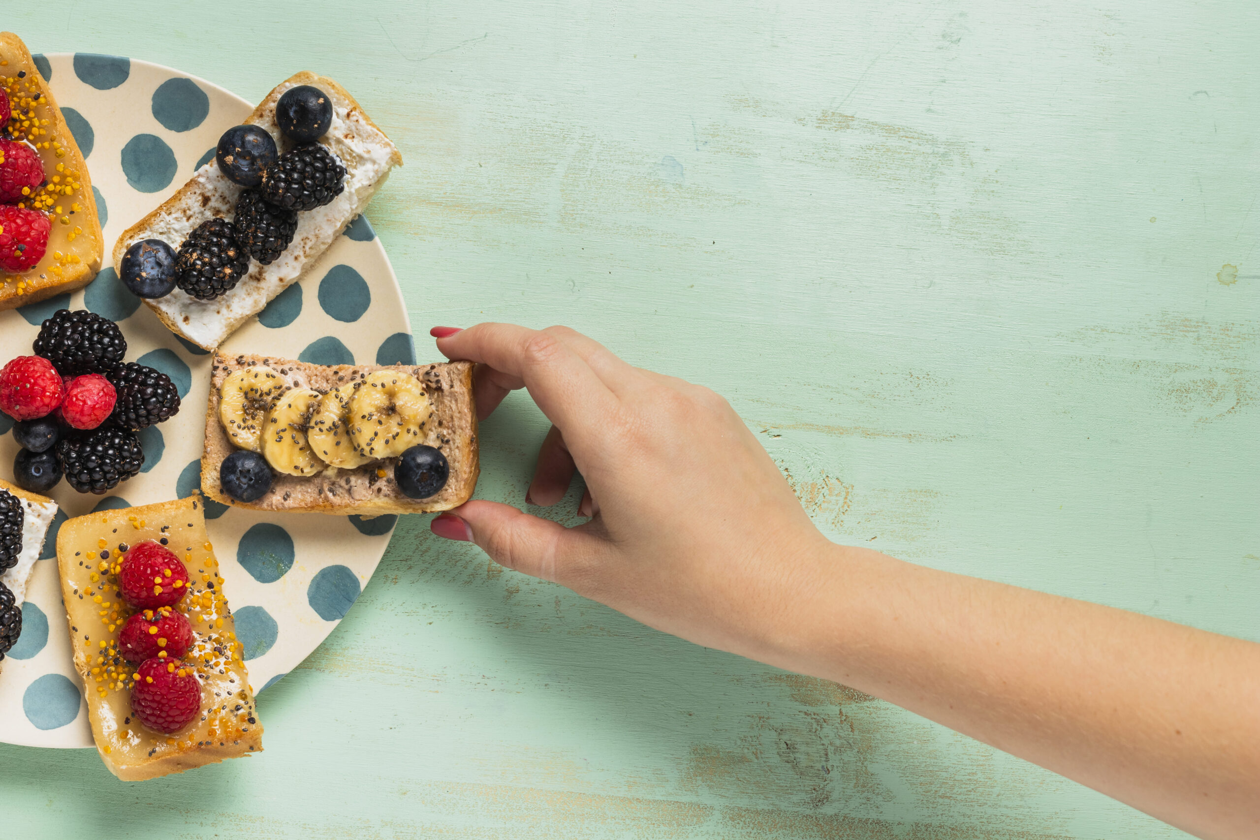 Excited person holding a Pure Protein Bar in a healthy kitchen.