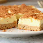 Cinnamon Churro Cheesecake Bars topped with a cinnamon sugar crust, showcasing a creamy, sweet dessert perfect for any occasion.